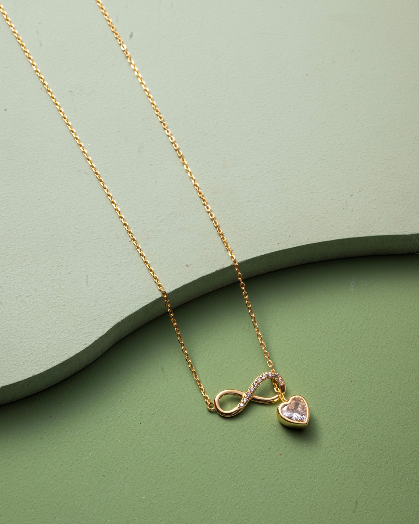 INFINITY PENDENT WITH HEART HANGINGS