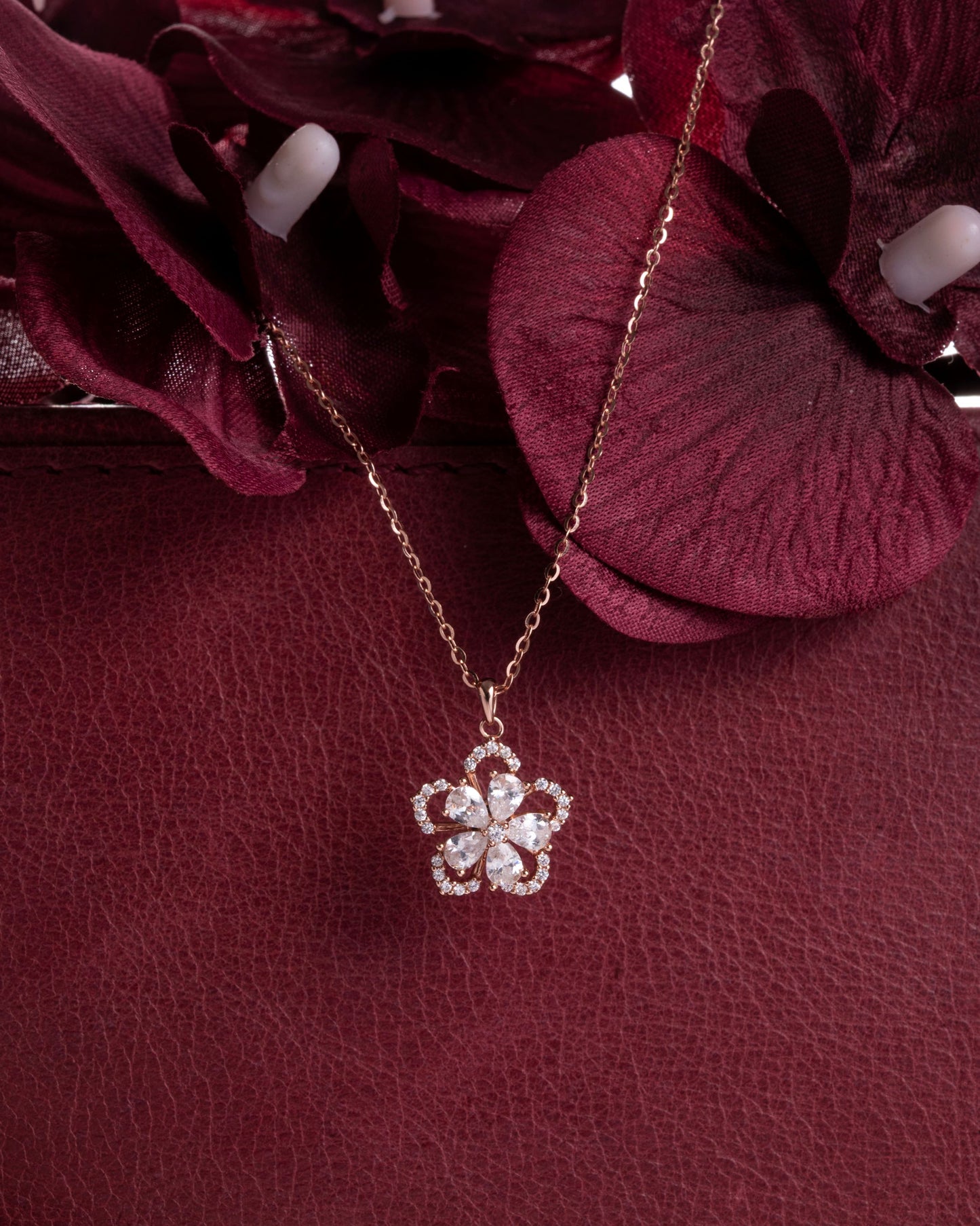 FLOWER PENDENT STUDDED WITH PEAR CUT CZ ALONGWITH LINK CHAIN