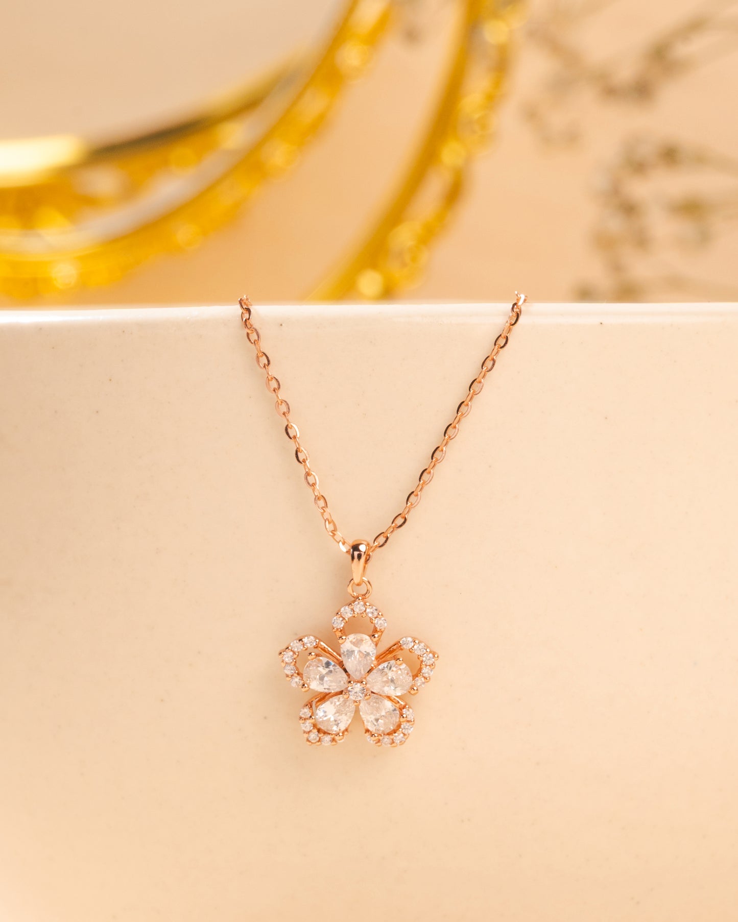 FLOWER PENDENT STUDDED WITH PEAR CUT CZ ALONG WITH LINK CHAIN