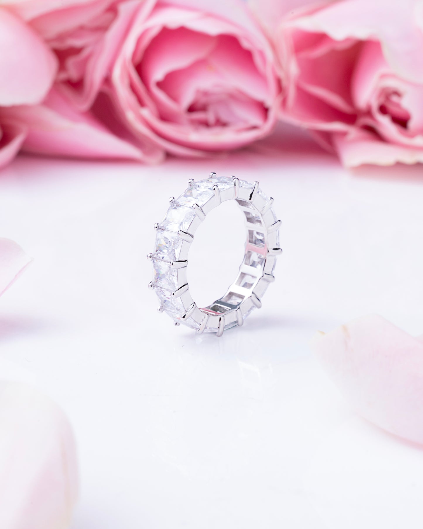 RING STUDDED WITH ICE CUT BLUE CZ