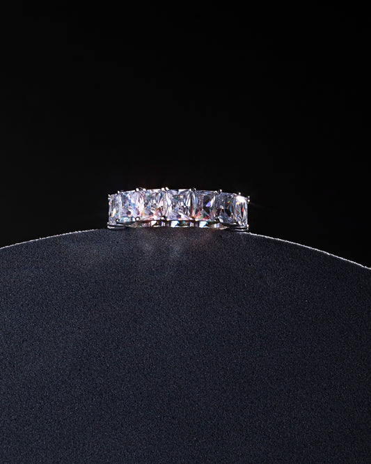 RING STUDDED WITH ICE CUT BLUE CZ