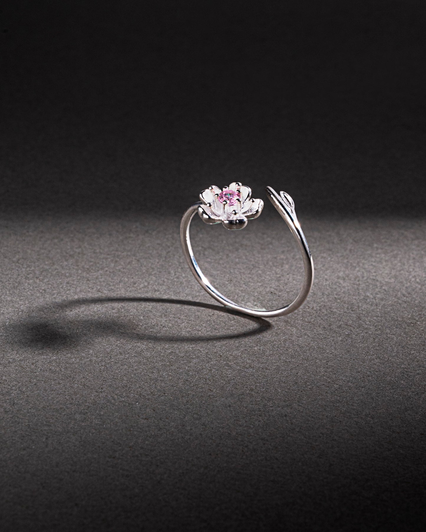 RING STUDDED WITH PINK ICE CUT CZ