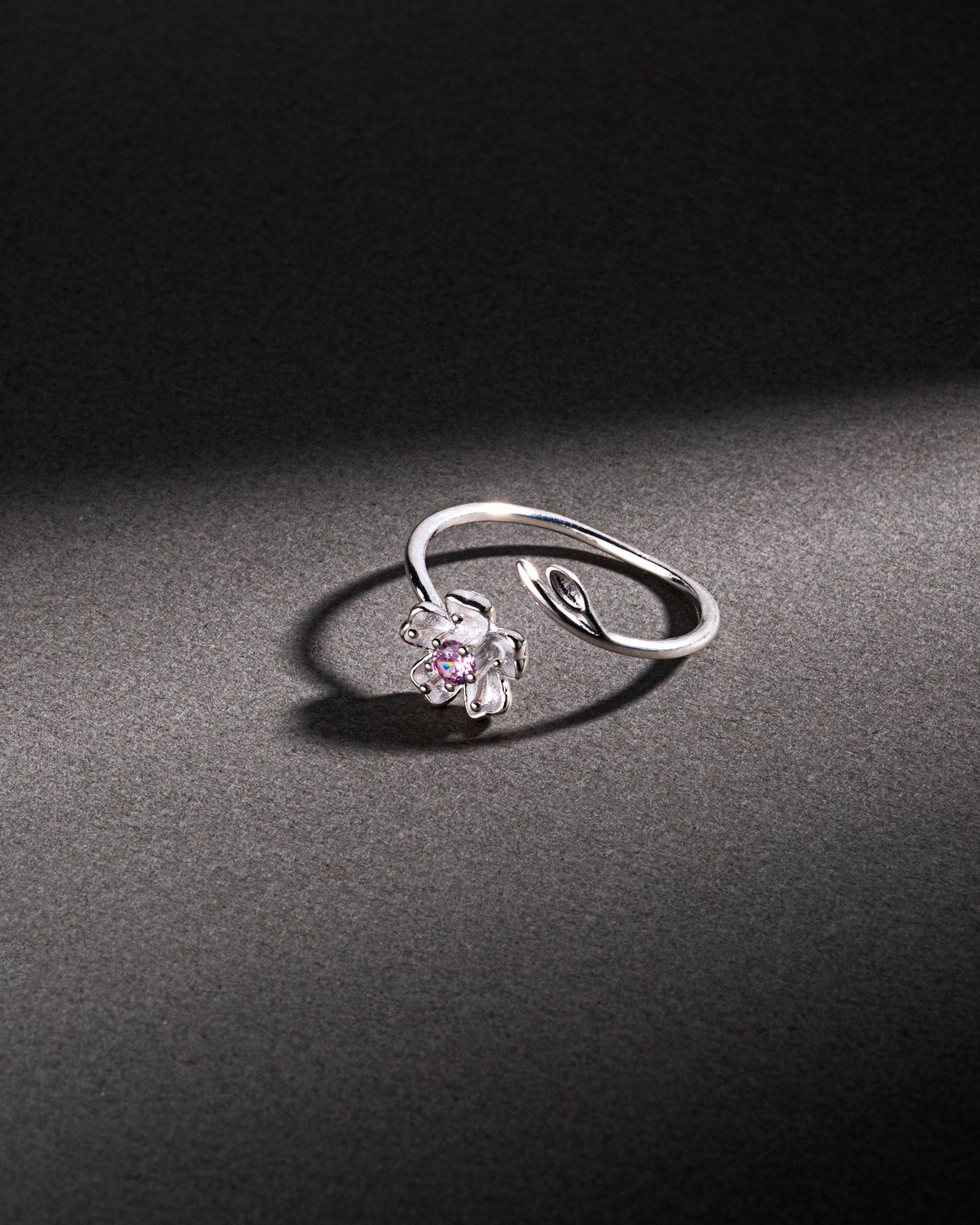 RING STUDDED WITH PINK ICE CUT CZ