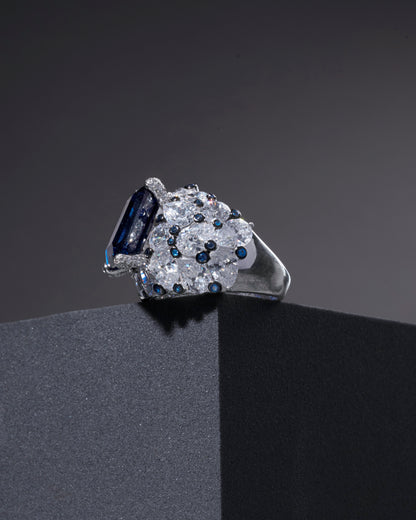 RING STUDDED WITH ICE CUT BLUE CZ