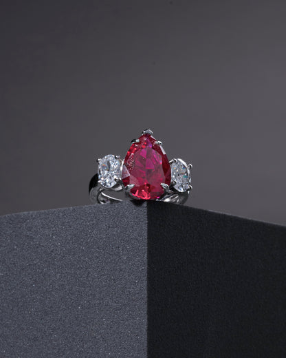 RING STUDDED WITH ICE CUT RED CZ